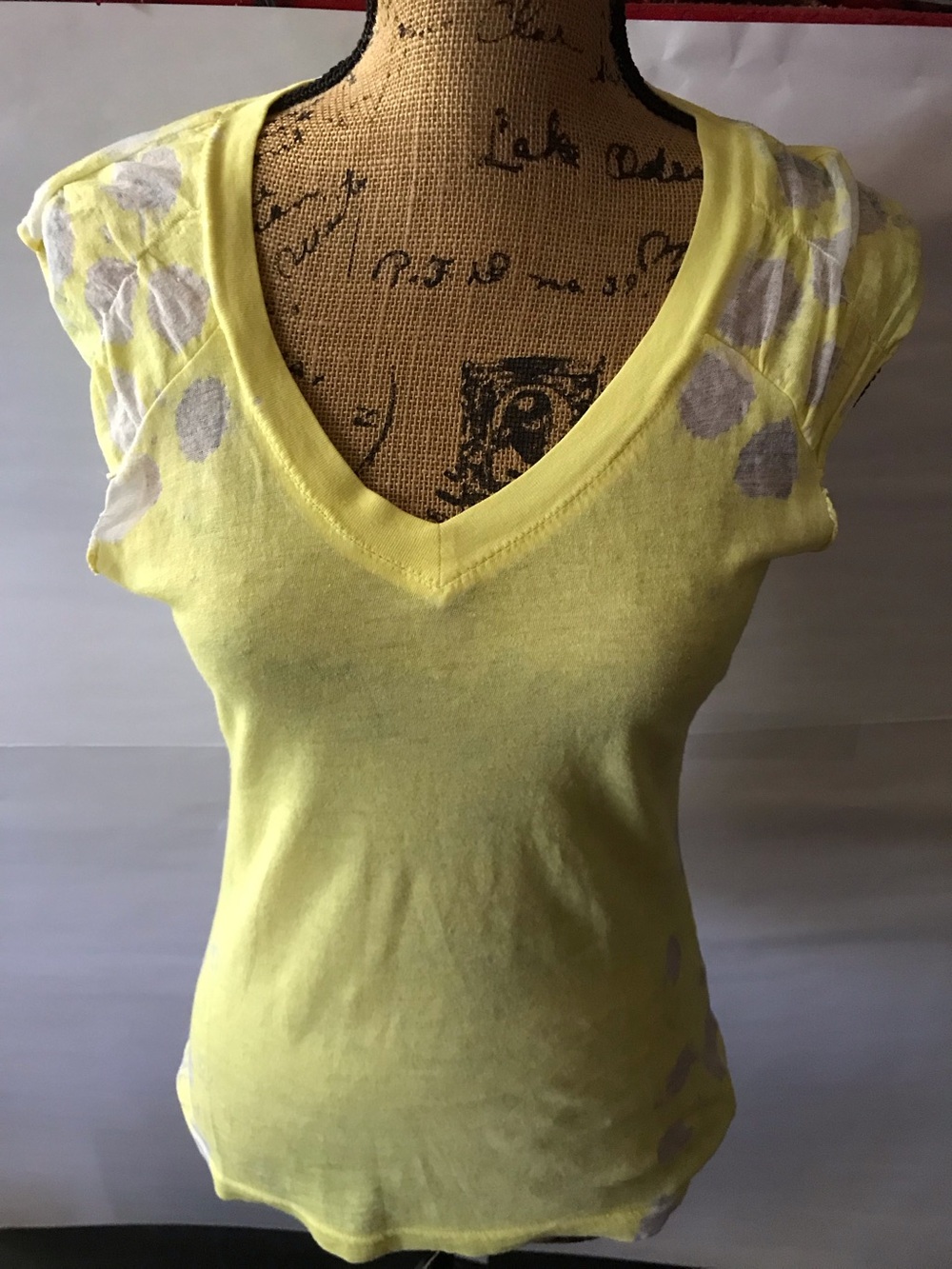 Yellow V-Neck Women's burn-out tshirt. Raw arms. Free People